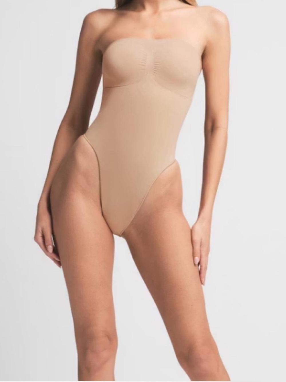 SKIMS Seamless Sculpt Strapless Thong Bodysuit in Mica Brown